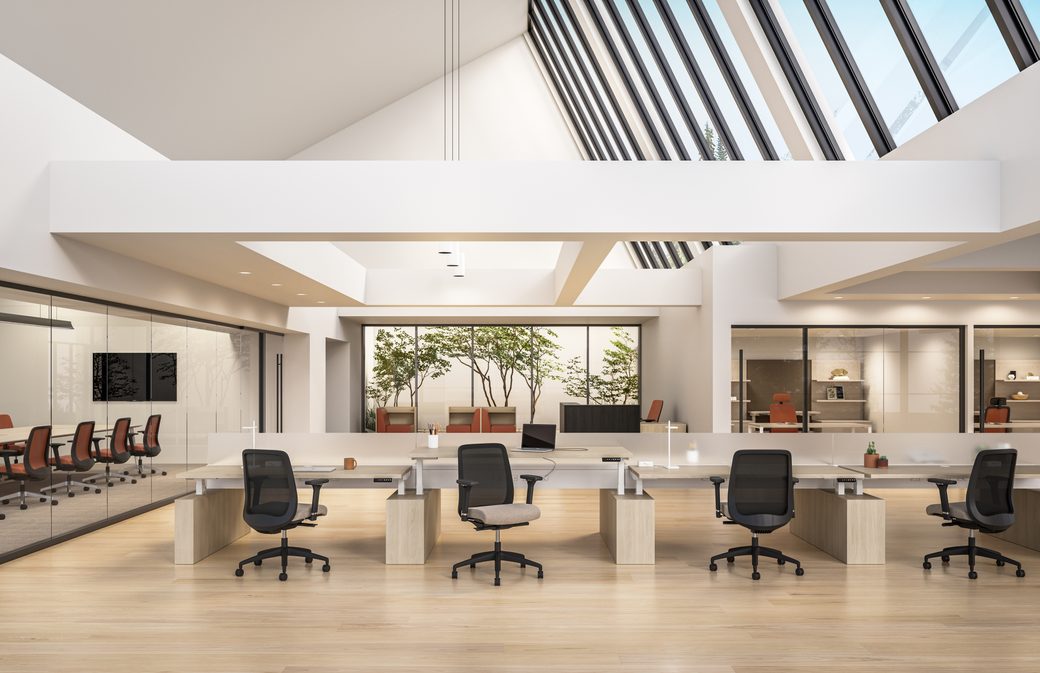 Open office with ergonomic task chairs and height-adjustable desks